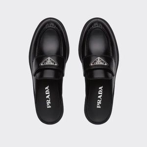 Prada loafers.